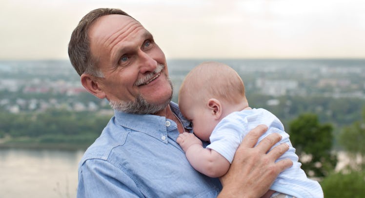 grandfather holding baby