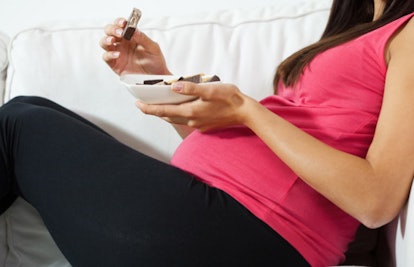 pregnant woman eating chocolate