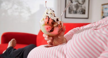 pregnant woman eating ice cream sundae