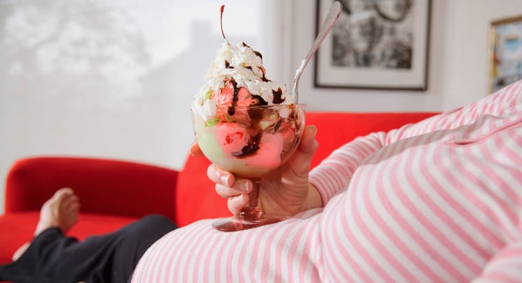 pregnant woman eating ice cream sundae
