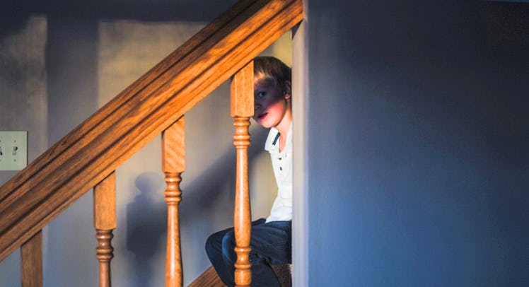 punished kid sitting on staircase