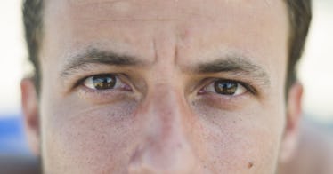 A closeup of an adult male face