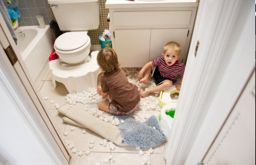 boys making mess in bathroom