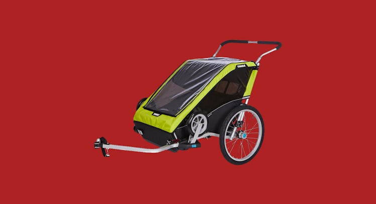 The Thule Chariot Bike Trailer showcased against a red background