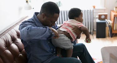 dad checking baby's diaper