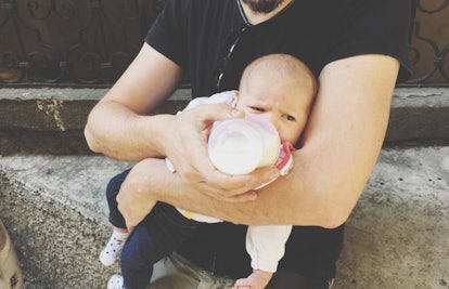 dad feeding baby