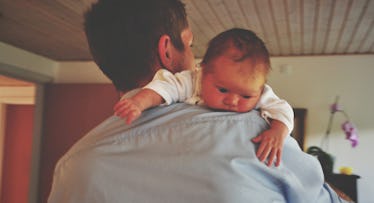 dad holding newborn baby