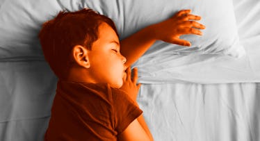 toddler sleeping on a bed