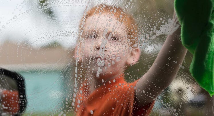kid washing car window