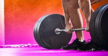 A powerlifter holding about to lift weights off the ground 