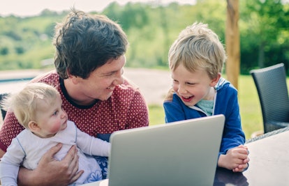 dad and children using computer