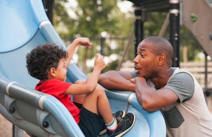 father and son at playground