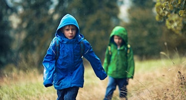 kids hiking in the rain