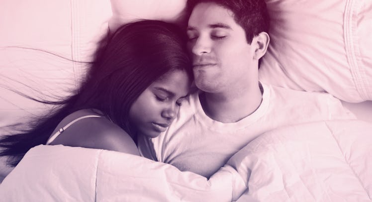 A husband and wife sleeping together 