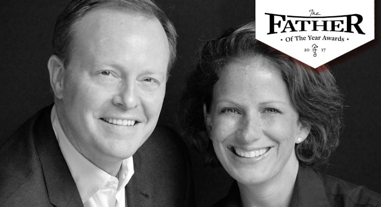 Full-profiled Amy and Ben Wright and a "Father of the Year Awards" text sign