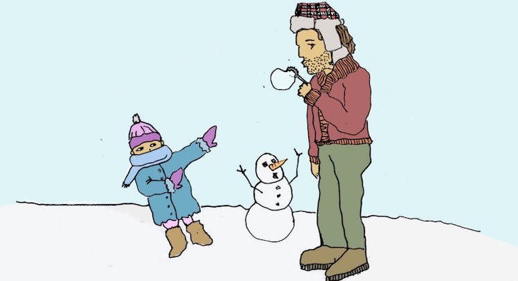 A father doing freezing bubbles in front of his child