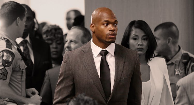 Adrian Peterson standing in a group of people- he is in color while everyone else is black and white