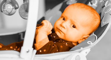 new born baby in a baby bouncer