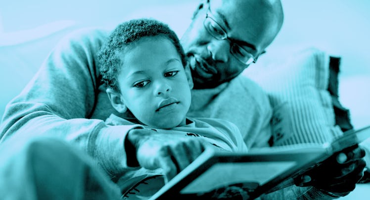 A dad reading a book to his kid who is visibly bored