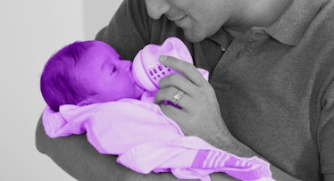 greyscale edit of dad feeding newborn with a sanitized baby bottle