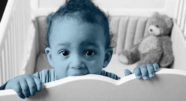 blue scale edit of a baby chewing on crib