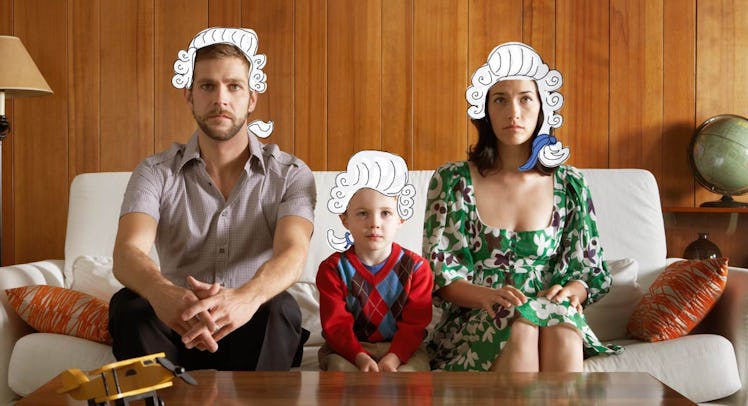 Parents sitting on a couch with their son and with George Washington hairstyle filters