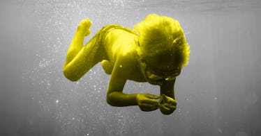 A child swimming under water