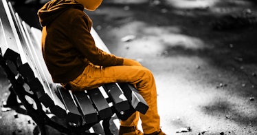 A child sitting on the bench