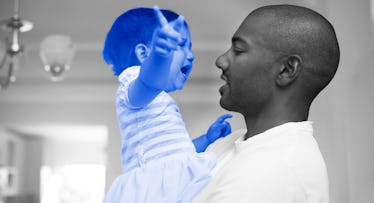 photo of a father holding a crying, shouting toddler illustrating how to give positive discipline