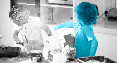 Two kids having a food fight, throwing flour while making cookies in the kitchen together