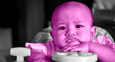 purple edit of 7-month-old baby sitting in highchair resting face on hand looking bored