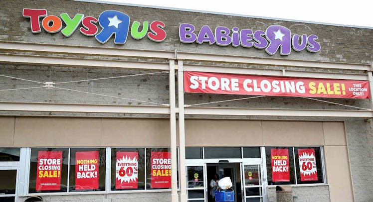 A "Toys ‘R’ Us" store with several store closing sale signs