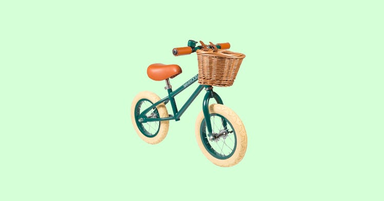 The best balance bike, Banwood First Go pictured against a green backdrop