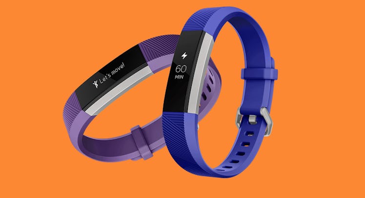 Blue and purple Fitbit fitness trackers