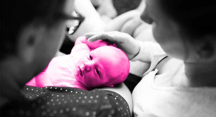 parents, edited to be black and white, holding their baby, edited to be purple, during the flu seaso...