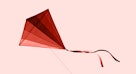 这是一个自己制作的风筝，有各种深浅不一的红色，从最亮到最暗。
