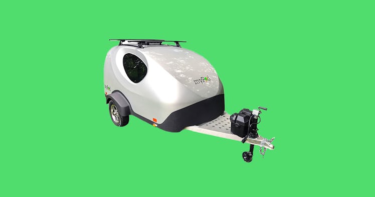 teardrop travel trailer camper on a green background