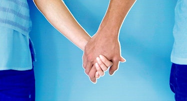 A happy couple holding hands with a blue background