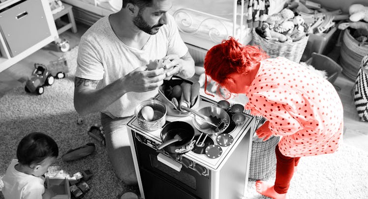 A father, a girl, and a toddler sitting on the floor and playing with kids cooking toys, to learn ab...