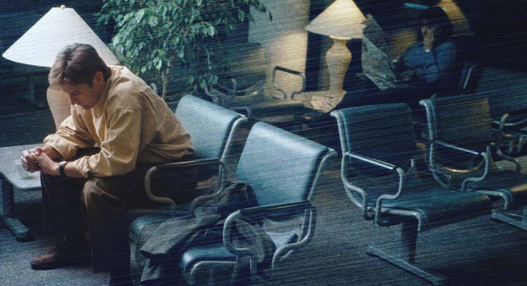 A man sitting in a waiting room, waiting for his wife who is going through the process of artificial...