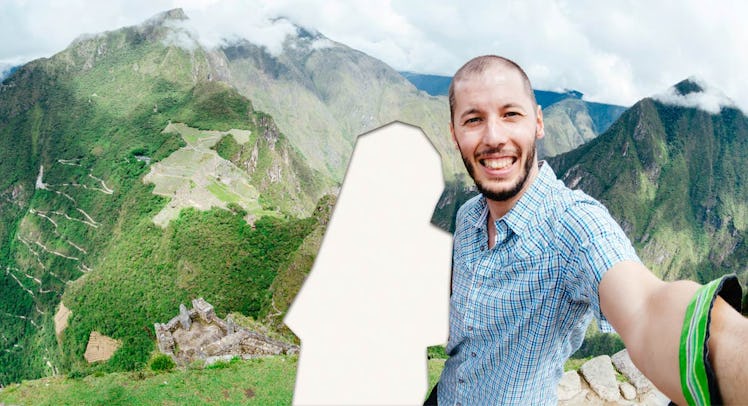 A selfie of a couple on vacation in front of a mountain range with the wife cut out of the picture