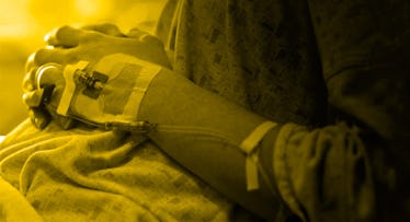 a pregnant woman with an IV attached to her arm feeding her pitocin to induce labor