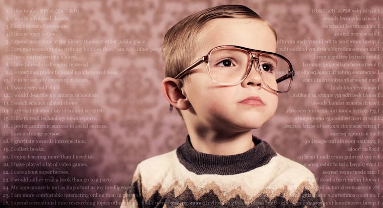 A nerdy child in glasses and a sweater.