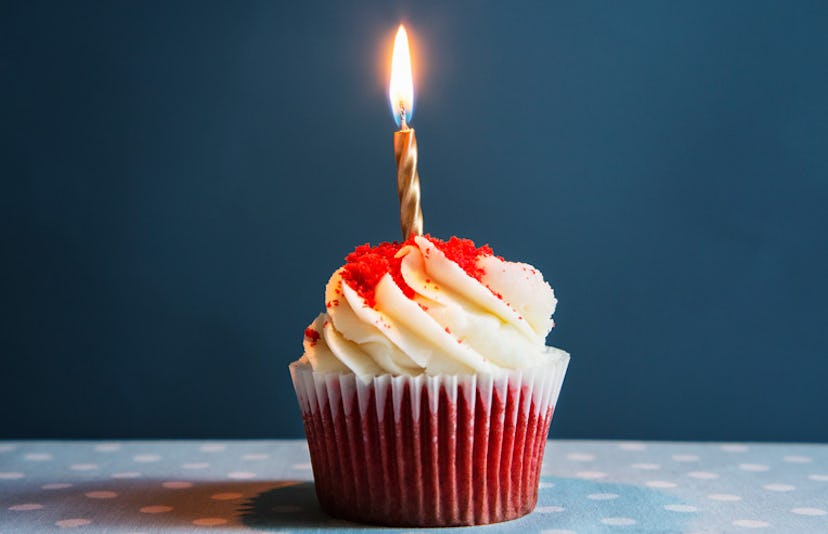 A white cupcake with a candle