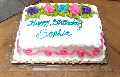 A sheet cake with "Happy Birthday Sophia" on it