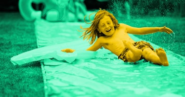 green photo edit of a laughing boy gliding down a homemade slip-and-slide