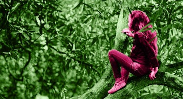 Girl learning how to climb a tree safely. 