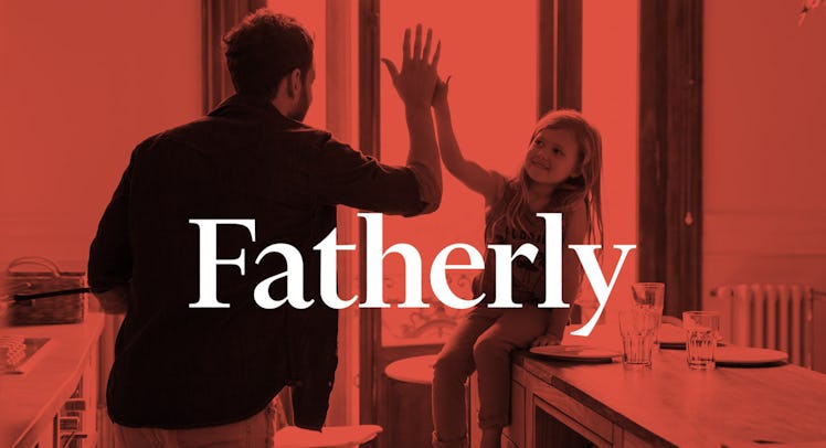 A dad high-fiving his daughter