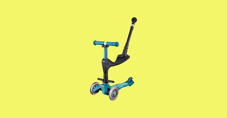 A toddler ride-on toy scooter set against a yellow backdrop.