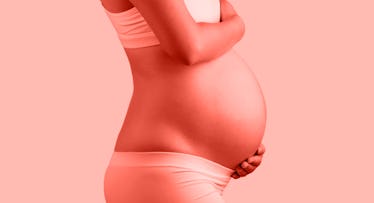 redscale edit of a pregnant person in bra and underwear holding their belly.
